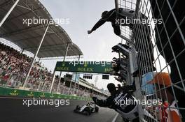 Sergio Perez (MEX) Sahara Force India F1 celebrates his third position at the end of the race as he passes his team on the pit wall. 19.06.2016. Formula 1 World Championship, Rd 8, European Grand Prix, Baku Street Circuit, Azerbaijan, Race Day.