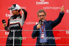 (L to R): Sergio Perez (MEX) Sahara Force India F1 on the podium with Eddie Jordan (IRE). 19.06.2016. Formula 1 World Championship, Rd 8, European Grand Prix, Baku Street Circuit, Azerbaijan, Race Day.