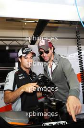 (L to R): Sergio Perez (MEX) Sahara Force India F1 with Enrique Iglesias (ESP) Singer. 19.06.2016. Formula 1 World Championship, Rd 8, European Grand Prix, Baku Street Circuit, Azerbaijan, Race Day.