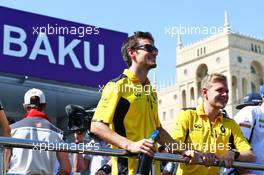 (L to R): Jolyon Palmer (GBR) Renault Sport F1 Team and team mate Kevin Magnussen (DEN) Renault Sport F1 Team on the drivers parade. 19.06.2016. Formula 1 World Championship, Rd 8, European Grand Prix, Baku Street Circuit, Azerbaijan, Race Day.