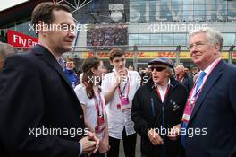 George Osborne MP (GBR) Chancellor of the Exchequer (Left) on the grid with Jackie Stewart (GBR). 10.07.2016. Formula 1 World Championship, Rd 10, British Grand Prix, Silverstone, England, Race Day.