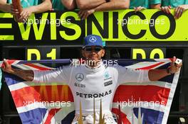 Race winner Lewis Hamilton (GBR) Mercedes AMG F1 celebrates with the team. 10.07.2016. Formula 1 World Championship, Rd 10, British Grand Prix, Silverstone, England, Race Day.