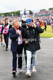 Lewis Hamilton (GBR) Mercedes AMG F1 with Johnny Herbert (GBR) Sky Sports F1 Presenter on the drivers parade. 10.07.2016. Formula 1 World Championship, Rd 10, British Grand Prix, Silverstone, England, Race Day.