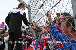 Jenson Button (GBR) McLaren with fans on the drivers parade. 10.07.2016. Formula 1 World Championship, Rd 10, British Grand Prix, Silverstone, England, Race Day.