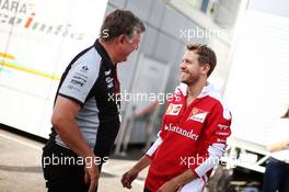 (L to R): Otmar Szafnauer (USA) Sahara Force India F1 Chief Operating Officer with Sebastian Vettel (GER) Ferrari. 29.07.2016. Formula 1 World Championship, Rd 12, German Grand Prix, Hockenheim, Germany, Practice Day.