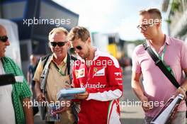 Sebastian Vettel (GER) Ferrari signs autographs for the fans. 29.07.2016. Formula 1 World Championship, Rd 12, German Grand Prix, Hockenheim, Germany, Practice Day.