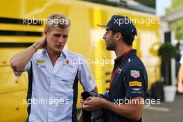 (L to R): Marcus Ericsson (SWE) Sauber F1 Team with Daniel Ricciardo (AUS) Red Bull Racing. 29.07.2016. Formula 1 World Championship, Rd 12, German Grand Prix, Hockenheim, Germany, Practice Day.