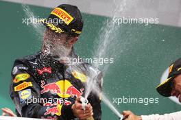 Daniel Ricciardo (AUS) Red Bull Racing celebrates his second position with the champagne on the podium. 31.07.2016. Formula 1 World Championship, Rd 12, German Grand Prix, Hockenheim, Germany, Race Day.