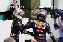 (L to R): Daniel Ricciardo (AUS) Red Bull Racing celebrates his 23t position with third placed team mate Max Verstappen (NLD) Red Bull Racing in parc ferme. 31.07.2016. Formula 1 World Championship, Rd 12, German Grand Prix, Hockenheim, Germany, Race Day.