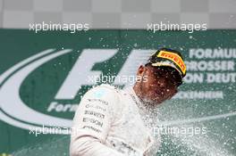 Race winner Lewis Hamilton (GBR) Mercedes AMG F1 celebrates with the champagne on the podium. 31.07.2016. Formula 1 World Championship, Rd 12, German Grand Prix, Hockenheim, Germany, Race Day.