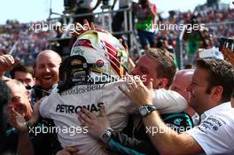 1st place Lewis Hamilton (GBR) Mercedes AMG F1 W07  celebrates with the team. 24.07.2016. Formula 1 World Championship, Rd 11, Hungarian Grand Prix, Budapest, Hungary, Race Day.