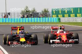 Max Verstappen (NLD) Red Bull Racing RB12 and Kimi Raikkonen (FIN) Ferrari SF16-H battle for position. 24.07.2016. Formula 1 World Championship, Rd 11, Hungarian Grand Prix, Budapest, Hungary, Race Day.