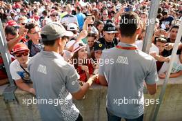 (L to R): Rio Haryanto (IDN) Manor Racing and team mate Pascal Wehrlein (GER) Manor Racing sign autographs for the fans. 21.07.2016. Formula 1 World Championship, Rd 11, Hungarian Grand Prix, Budapest, Hungary, Preparation Day.