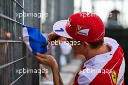 Kimi Raikkonen (FIN) Ferrari signs autographs for the fans. 21.07.2016. Formula 1 World Championship, Rd 11, Hungarian Grand Prix, Budapest, Hungary, Preparation Day.