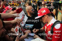 Kimi Raikkonen (FIN) Ferrari signs autographs for the fans. 04.09.2016. Formula 1 World Championship, Rd 14, Italian Grand Prix, Monza, Italy, Race Day.