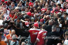 Kimi Raikkonen (FIN) Ferrari signs autographs for the fans. 01.09.2016. Formula 1 World Championship, Rd 14, Italian Grand Prix, Monza, Italy, Preparation Day.