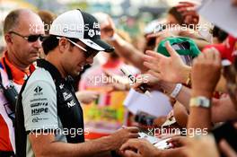 Sergio Perez (MEX) Sahara Force India F1 signs autographs for the fans. 01.09.2016. Formula 1 World Championship, Rd 14, Italian Grand Prix, Monza, Italy, Preparation Day.
