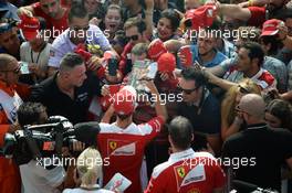 Sebastian Vettel (GER) Ferrari signs autographs for the fans. 01.09.2016. Formula 1 World Championship, Rd 14, Italian Grand Prix, Monza, Italy, Preparation Day.