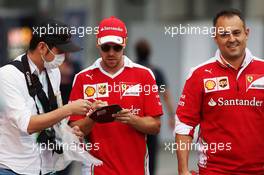Sebastian Vettel (GER) Ferrari signs autographs for the fans. 07.10.2016. Formula 1 World Championship, Rd 17, Japanese Grand Prix, Suzuka, Japan, Practice Day.