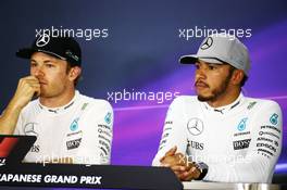 (L to R): Nico Rosberg (GER) Mercedes AMG F1 and team mate Lewis Hamilton (GBR) Mercedes AMG F1 in the FIA Press Conference. 09.10.2016. Formula 1 World Championship, Rd 17, Japanese Grand Prix, Suzuka, Japan, Race Day.