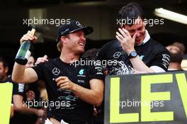 Race winner Nico Rosberg (GER) Mercedes AMG F1 celebrates winning the constructors' championship with Toto Wolff (GER) Mercedes AMG F1 Shareholder and Executive Director and the team. 09.10.2016. Formula 1 World Championship, Rd 17, Japanese Grand Prix, Suzuka, Japan, Race Day.
