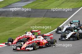 Sebastian Vettel (GER) Ferrari SF16-H and team mate Kimi Raikkonen (FIN) Ferrari SF16-H battle for position. 09.10.2016. Formula 1 World Championship, Rd 17, Japanese Grand Prix, Suzuka, Japan, Race Day.