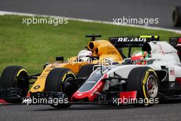 Esteban Gutierrez (MEX) Haas F1 Team VF-16 and Kevin Magnussen (DEN) Renault Sport F1 Team RS16. 08.10.2016. Formula 1 World Championship, Rd 17, Japanese Grand Prix, Suzuka, Japan, Qualifying Day.