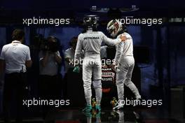 (L to R): Nico Rosberg (GER) Mercedes AMG F1 and team mate Lewis Hamilton (GBR) Mercedes AMG F1 in parc ferme. 08.10.2016. Formula 1 World Championship, Rd 17, Japanese Grand Prix, Suzuka, Japan, Qualifying Day.