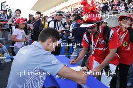 Esteban Ocon (FRA) Manor Racing signs autographs for the fans. 06.10.2016. Formula 1 World Championship, Rd 17, Japanese Grand Prix, Suzuka, Japan, Preparation Day.