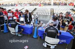 (L to R): Sergio Perez (MEX) Sahara Force India F1 and team mate Nico Hulkenberg (GER) Sahara Force India F1 sign autographs for the fans. 06.10.2016. Formula 1 World Championship, Rd 17, Japanese Grand Prix, Suzuka, Japan, Preparation Day.