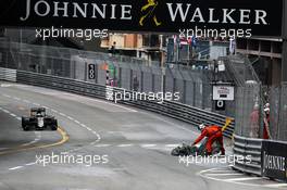 A marshal removes debris from the circuit. 29.05.2015. Formula 1 World Championship, Rd 6, Monaco Grand Prix, Monte Carlo, Monaco, Race Day.