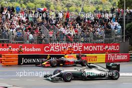 Daniel Ricciardo (AUS) Red Bull Racing RB12 exits the pits alongside Lewis Hamilton (GBR) Mercedes AMG F1 W07 Hybrid. 29.05.2015. Formula 1 World Championship, Rd 6, Monaco Grand Prix, Monte Carlo, Monaco, Race Day.