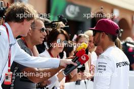 Lewis Hamilton (GBR) Mercedes AMG F1 with Kai Ebel (GER) RTL TV Presenter. 26.05.2016. Formula 1 World Championship, Rd 6, Monaco Grand Prix, Monte Carlo, Monaco, Practice Day.