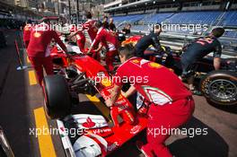 Ferrari SF16-H and a Red Bull Racing RB12 in the pit lane. 25.05.2016. Formula 1 World Championship, Rd 6, Monaco Grand Prix, Monte Carlo, Monaco, Preparation Day.
