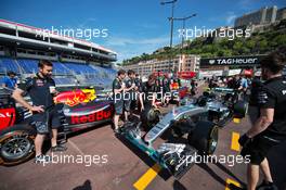 Mercedes AMG F1 W07 Hybrid and a Red Bull Racing RB12 in the pit lane. 25.05.2016. Formula 1 World Championship, Rd 6, Monaco Grand Prix, Monte Carlo, Monaco, Preparation Day.