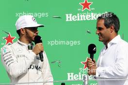 (L to R): Lewis Hamilton (GBR) Mercedes AMG F1 on the podium with Juan Pablo Montoya (COL). 30.10.2016. Formula 1 World Championship, Rd 19, Mexican Grand Prix, Mexico City, Mexico, Race Day.