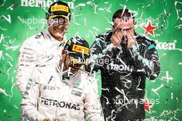Race winner Lewis Hamilton (GBR) Mercedes AMG F1 celebrates on the podium with Nico Rosberg (GER) Mercedes AMG F1 and Tony Walton (GBR) Mercedes AMG F1 Mechanic. 30.10.2016. Formula 1 World Championship, Rd 19, Mexican Grand Prix, Mexico City, Mexico, Race Day.