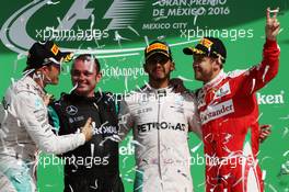 The podium (L to R): Nico Rosberg (GER) Mercedes AMG F1, second; Tony  Walton (GBR) Mercedes AMG F1 Mechanic; Lewis Hamilton (GBR) Mercedes AMG F1, race winner; Sebastian Vettel (GER) Ferrari, third. 30.10.2016. Formula 1 World Championship, Rd 19, Mexican Grand Prix, Mexico City, Mexico, Race Day.