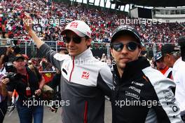 (L to R): Esteban Gutierrez (MEX) Haas F1 Team with Sergio Perez (MEX) Sahara Force India F1 on the drivers parade. 30.10.2016. Formula 1 World Championship, Rd 19, Mexican Grand Prix, Mexico City, Mexico, Race Day.