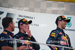 The podium (L to R): Christian Horner (GBR) Red Bull Racing Team Principal with second placed Max Verstappen (NLD) Red Bull Racing and race winner Daniel Ricciardo (AUS) Red Bull Racing. 02.10.2016. Formula 1 World Championship, Rd 16, Malaysian Grand Prix, Sepang, Malaysia, Sunday.