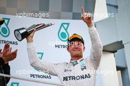 Nico Rosberg (GER) Mercedes AMG F1 celebrates his third position on the podium. 02.10.2016. Formula 1 World Championship, Rd 16, Malaysian Grand Prix, Sepang, Malaysia, Sunday.