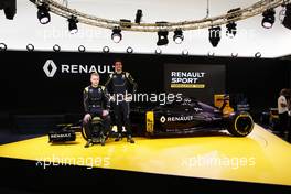 (L to R): Kevin Magnussen (DEN) Renault Sport Formula One Team with team mate Jolyon Palmer (GBR) Renault Sport Formula One Team. 03.02.2016. Renault Sport Formula One Team RS16 Launch, Renault Technocentre, Paris, France.