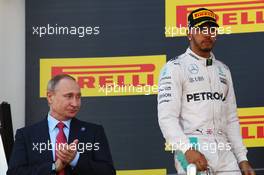 The podium (L to R): Vladimir Putin (RUS) Russian Federation President with second placed Lewis Hamilton (GBR) Mercedes AMG F1. 01.05.2016. Formula 1 World Championship, Rd 4, Russian Grand Prix, Sochi Autodrom, Sochi, Russia, Race Day.