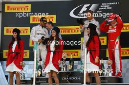 The podium (L to R): Lewis Hamilton (GBR) Mercedes AMG F1, second; Nico Rosberg (GER) Mercedes AMG F1, race winner; Kimi Raikkonen (FIN) Ferrari, third and grid girls. 01.05.2016. Formula 1 World Championship, Rd 4, Russian Grand Prix, Sochi Autodrom, Sochi, Russia, Race Day.