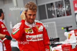 Sebastian Vettel (GER) Ferrari in parc ferme. 30.04.2016. Formula 1 World Championship, Rd 4, Russian Grand Prix, Sochi Autodrom, Sochi, Russia, Qualifying Day.