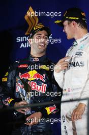 (L to R): second placed Daniel Ricciardo (AUS) Red Bull Racing and race winner Nico Rosberg (GER) Mercedes AMG F1 on the podium. 18.09.2016. Formula 1 World Championship, Rd 15, Singapore Grand Prix, Marina Bay Street Circuit, Singapore, Race Day.