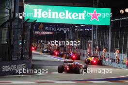 Sebastian Vettel (GER) Ferrari SF16-H follows the field through the pit lane behind the FIA Safety Car. 18.09.2016. Formula 1 World Championship, Rd 15, Singapore Grand Prix, Marina Bay Street Circuit, Singapore, Race Day.