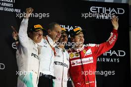 The podium (L to R): Nico Rosberg (GER) Mercedes AMG F1, second; Tony Ross (GBR) Mercedes AMG F1 Race Engineer; Lewis Hamilton (GBR) Mercedes AMG F1, race winner; Sebastian Vettel (GER) Ferrari, third. 27.11.2016. Formula 1 World Championship, Rd 21, Abu Dhabi Grand Prix, Yas Marina Circuit, Abu Dhabi, Race Day.