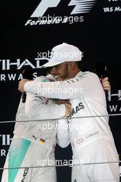 The podium (L to R): second placed Nico Rosberg (GER) Mercedes AMG F1 celebrates his World Championship with race winner and team mate Lewis Hamilton (GBR) Mercedes AMG F1. 27.11.2016. Formula 1 World Championship, Rd 21, Abu Dhabi Grand Prix, Yas Marina Circuit, Abu Dhabi, Race Day.