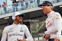 (L to R): Lewis Hamilton (GBR) Mercedes AMG F1 with Max Verstappen (NLD) Red Bull Racing on the drivers parade. 27.11.2016. Formula 1 World Championship, Rd 21, Abu Dhabi Grand Prix, Yas Marina Circuit, Abu Dhabi, Race Day.